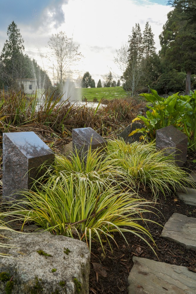 Granite markers on well-manicured lawn in Lakeside Cremation Garden