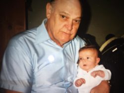 photo of a grandpa holding his newborn grandkid
