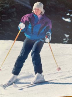 a woman skiing down the slopes