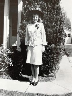 a woman dressed up and smiling