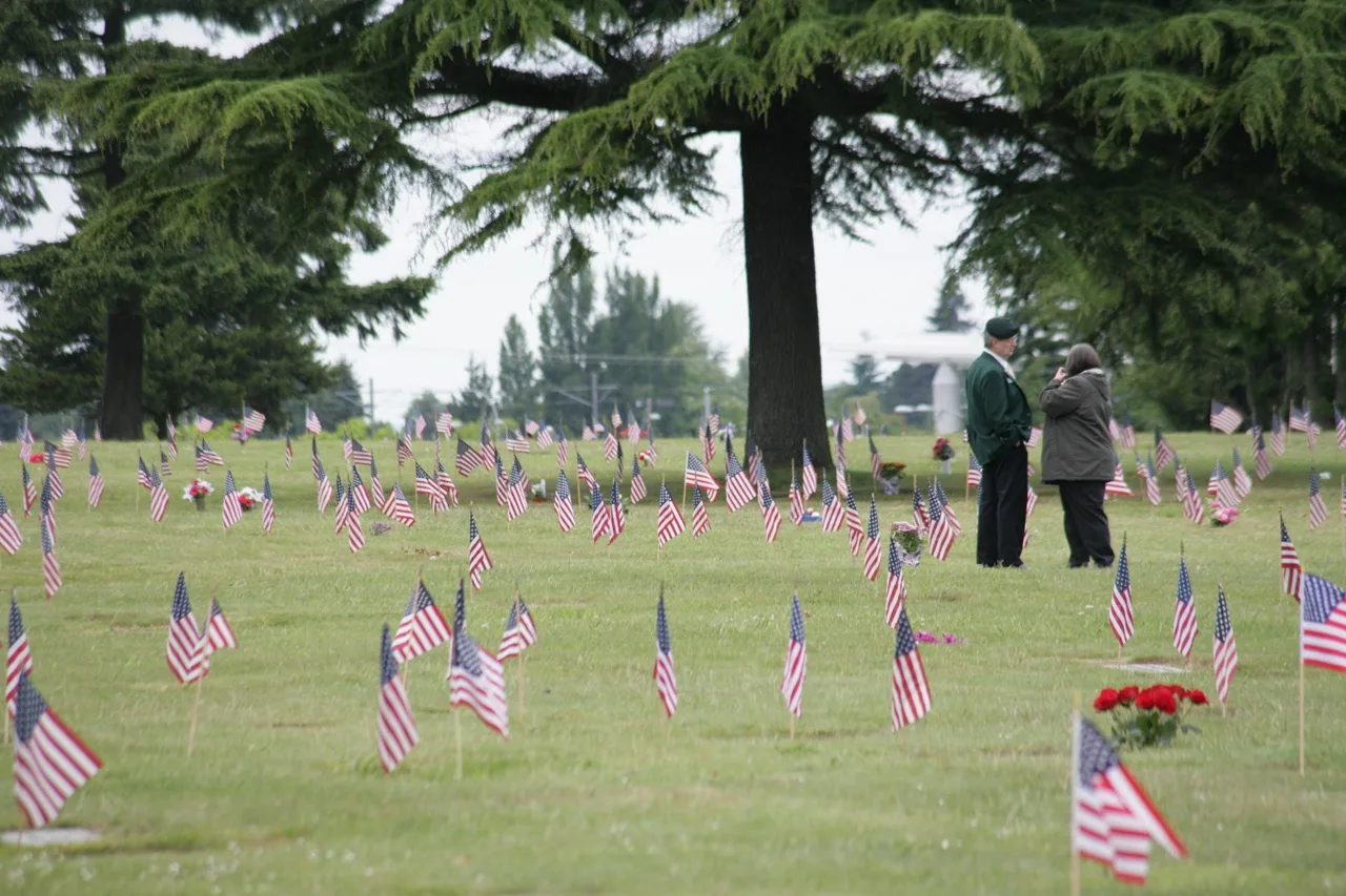 Planting flags to honor veterans on Memorial Day at BONNEY WATSON.